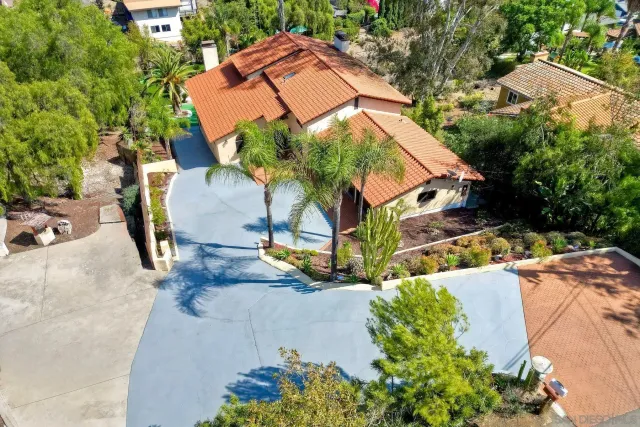 a aerial view of a house with swimming pool and garden view