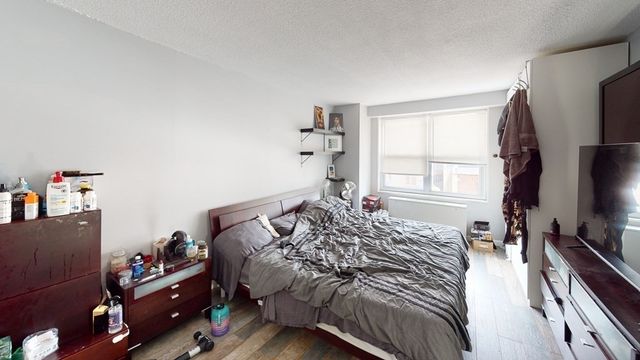 a bed room with a bed and a window