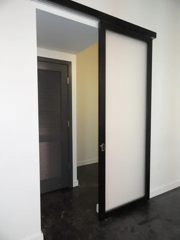 a view of a hallway with closet