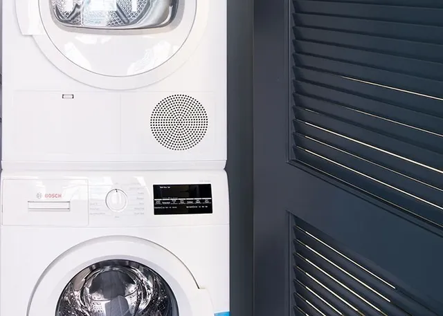 a close view of a utility room with washer and dryer