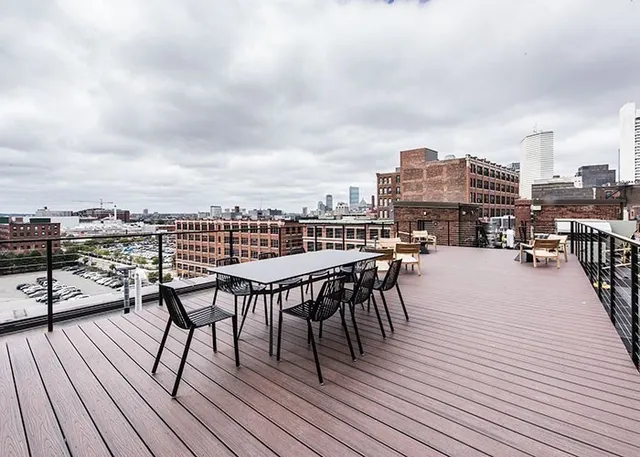 a view of roof deck with patio