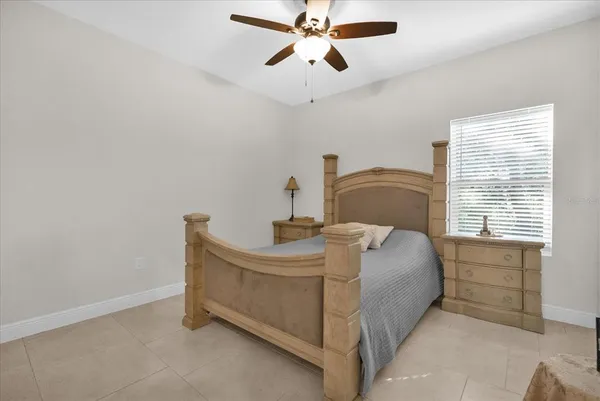 a bedroom with a bed and window