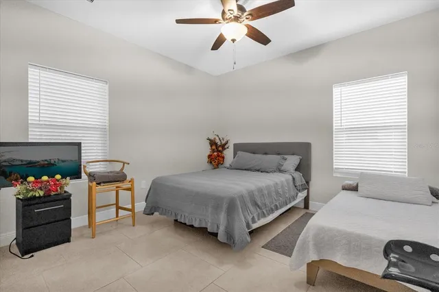 a bedroom with a bed and a couch