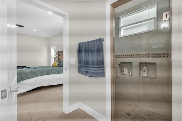 a bathroom with a tub and shower