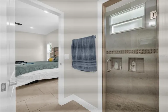 a bathroom with a tub and shower