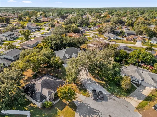 an aerial view of residential houses with outdoor space