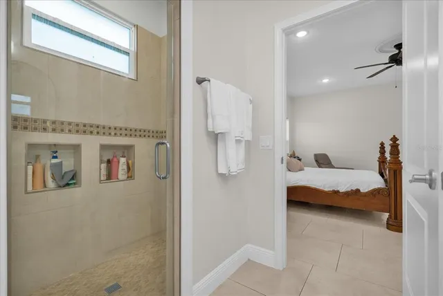 a bedroom with a bed and a view of bathroom