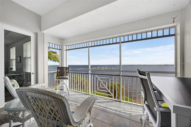 a view of a living room and a balcony