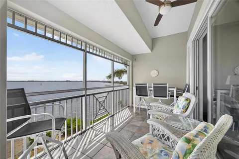 a bedroom with a bed and a flat tv screen on dresser
