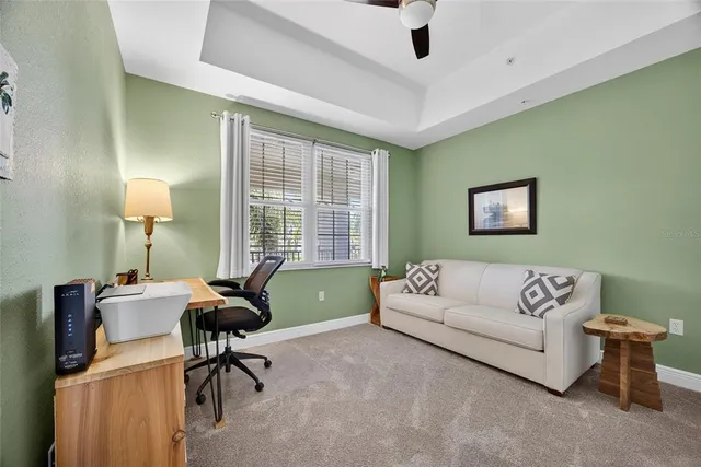 a bathroom with a granite countertop sink a toilet and a mirror
