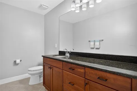 a stove top oven sitting inside of a kitchen