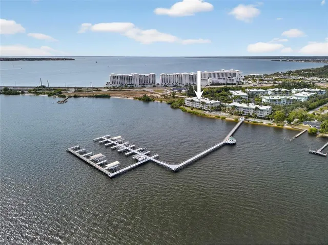an aerial view of a house with a ocean view
