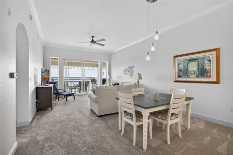 a view of a dining room with furniture and window