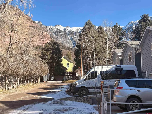 a view of a small yard from a balcony