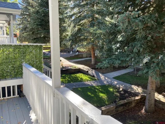 a view of front door with wooden floor