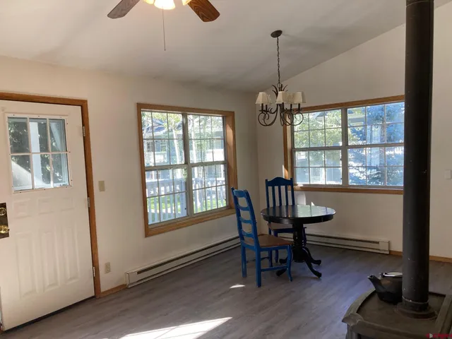 a dining room with furniture window wooden floor
