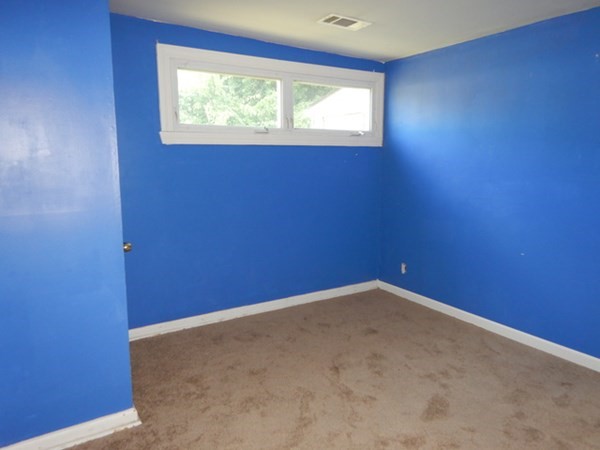 23 Vincent Street Springfield, MA 01129 - Photo 16 of 20 a view of an empty room with a window