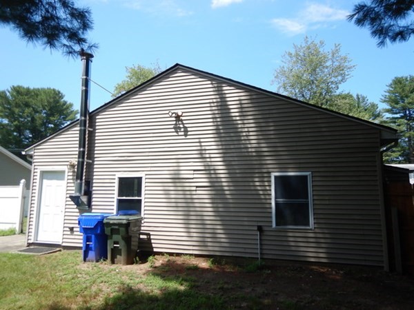 23 Vincent Street Springfield, MA 01129 - Photo 4 of 20 a view of a house with a yard and a garage
