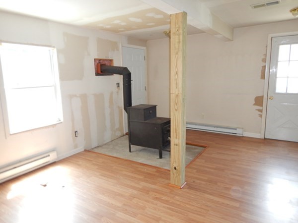 23 Vincent Street Springfield, MA 01129 - Photo 10 of 20 a view of an empty room with wooden floor and a window