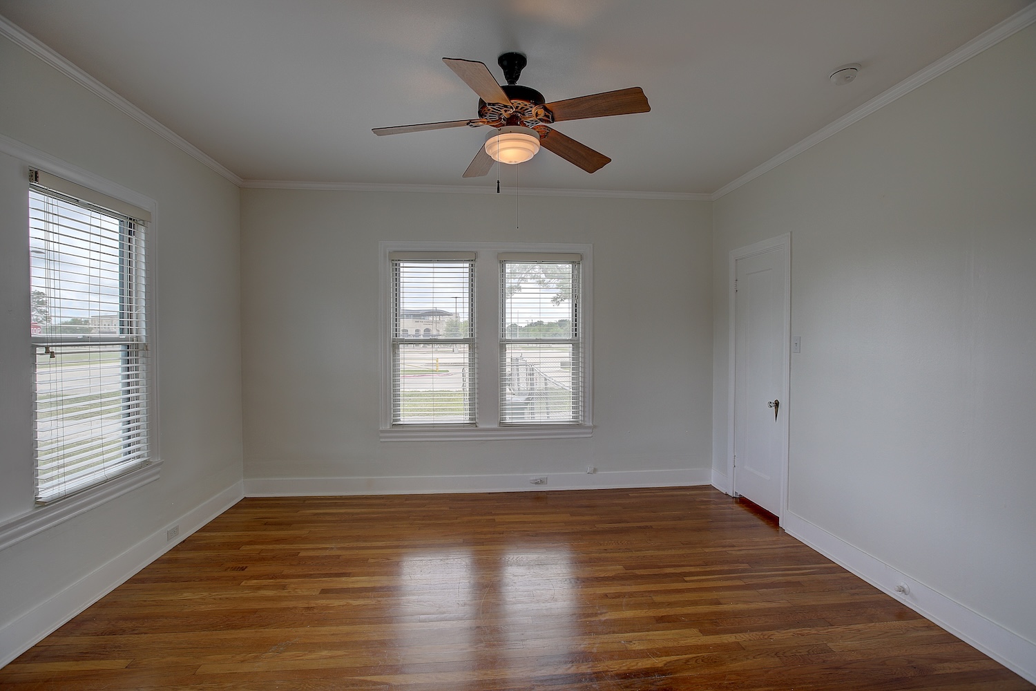 1708 Olive Street Georgetown, TX 78626 - Photo 22 of 40 a view of empty room with wooden floor and fan