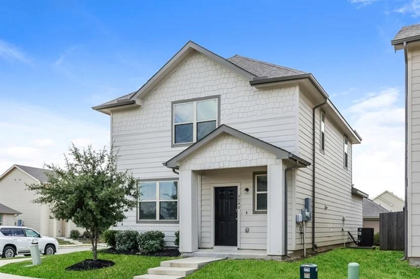 5540 Eagle Point Drive Fort Worth, TX 76119 - Photo 1 of 1 a front view of a house with a yard