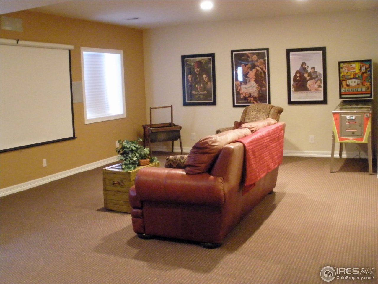 3338 Rookery Road Fort Collins, CO 80528 - Photo 18 of 25 a bed room with couch and paintings on the wall
