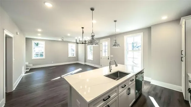 a kitchen with stove and cabinets