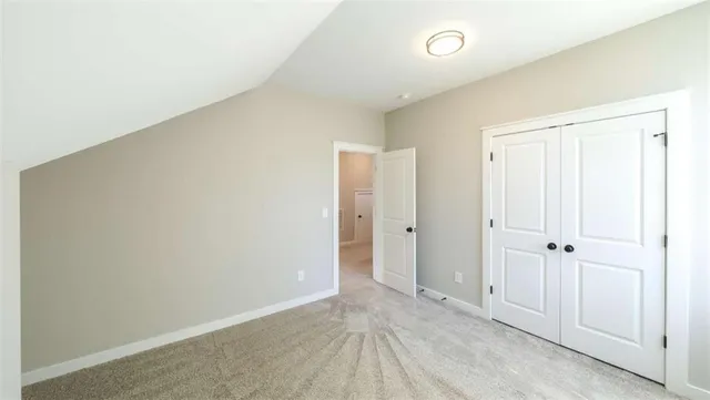 an empty room with closet area
