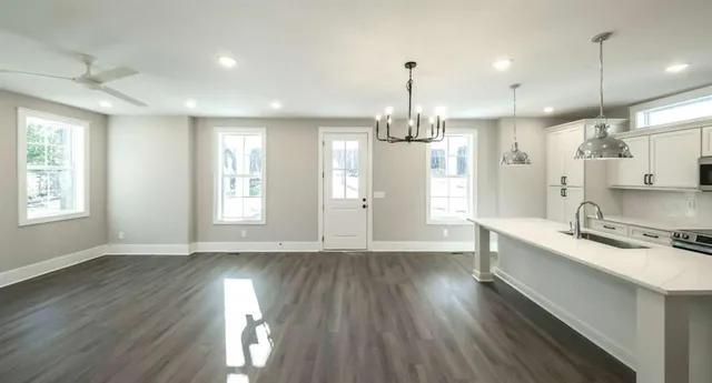a view of a kitchen and wooden floor