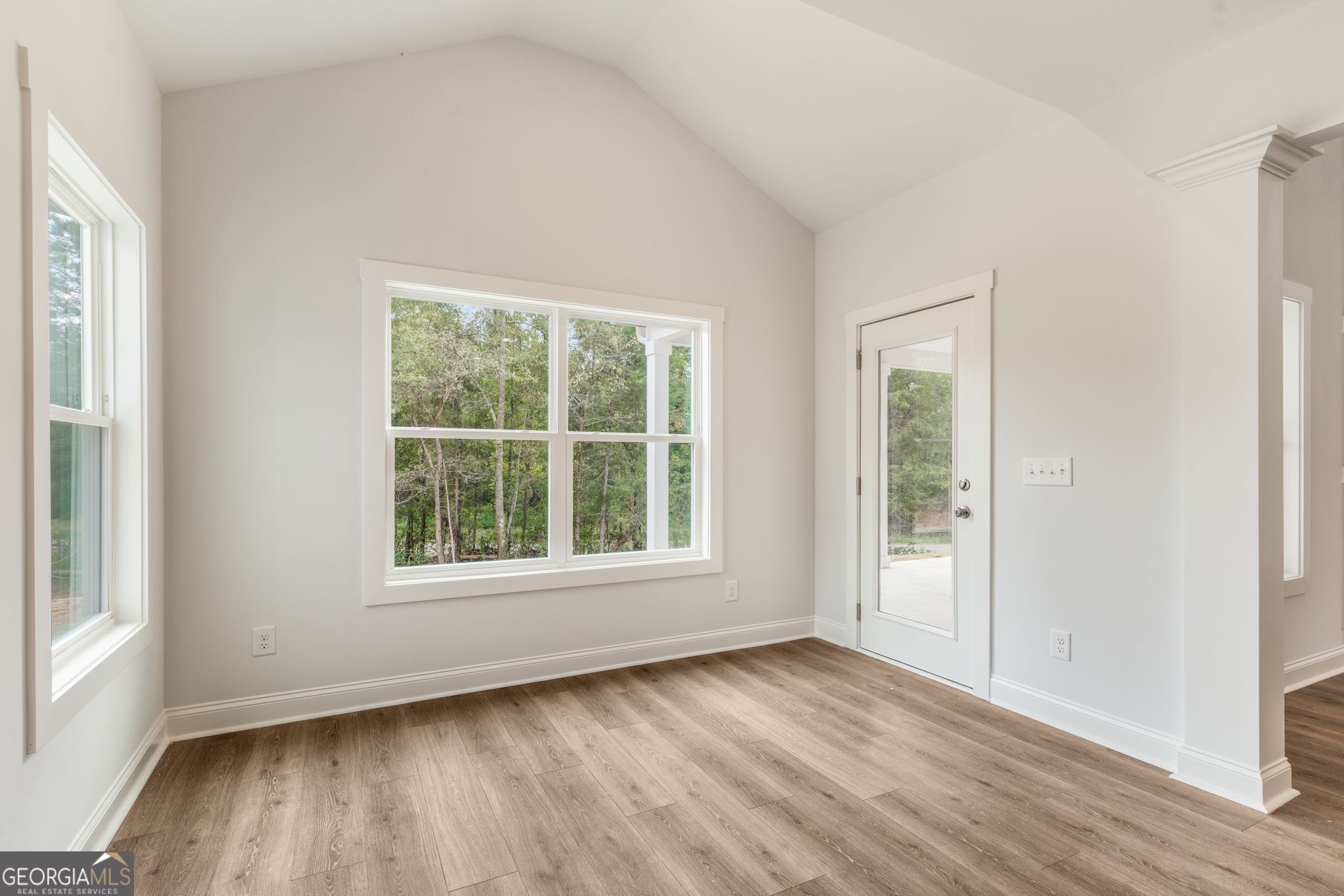 102 Mill Race Road Thomaston, GA 30286 - Photo 15 of 57 an empty room with wooden floor and windows