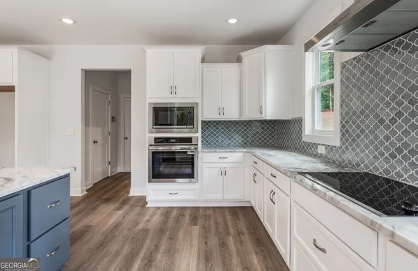 a view of walk in closet with clothes