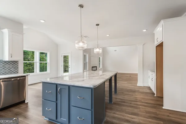 a bathroom with a sink toilet and mirror