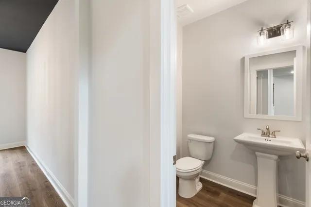 a view of an empty room and a ceiling fan