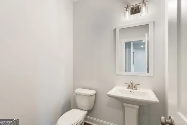a bathroom with a double vanity sink and mirror