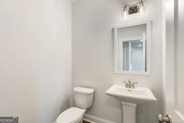 a bathroom with a double vanity sink and mirror