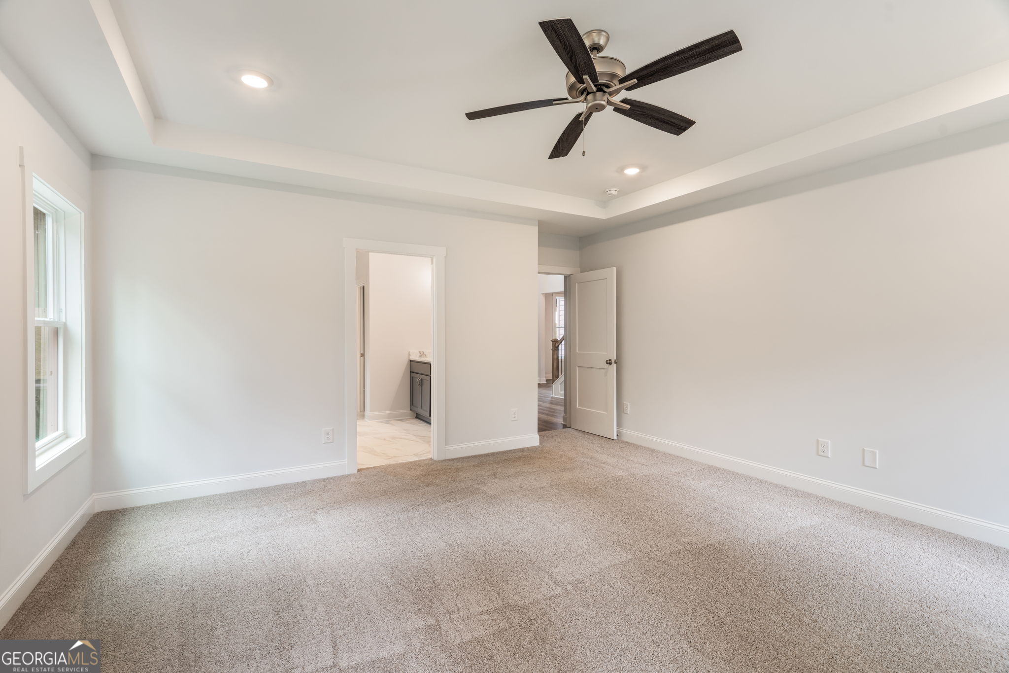 102 Mill Race Road Thomaston, GA 30286 - Photo 24 of 57 a view of an empty room and a ceiling fan