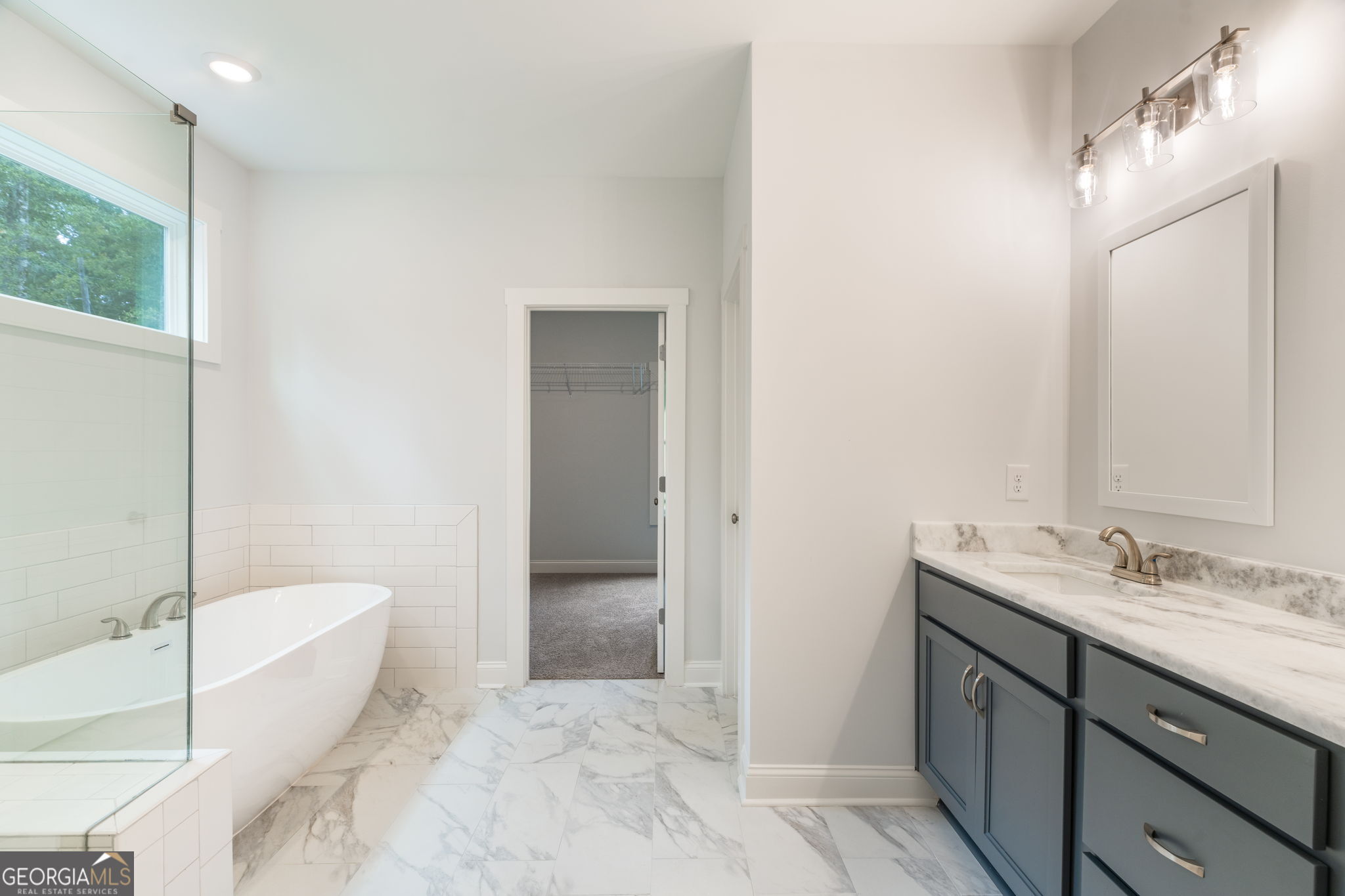 102 Mill Race Road Thomaston, GA 30286 - Photo 27 of 57 a spacious bathroom with a granite countertop sink and a mirror