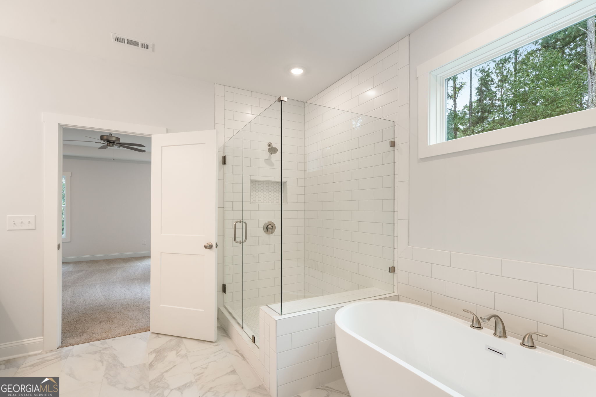 102 Mill Race Road Thomaston, GA 30286 - Photo 29 of 57 a bathroom with a bathtub shower sink vanity and toilet