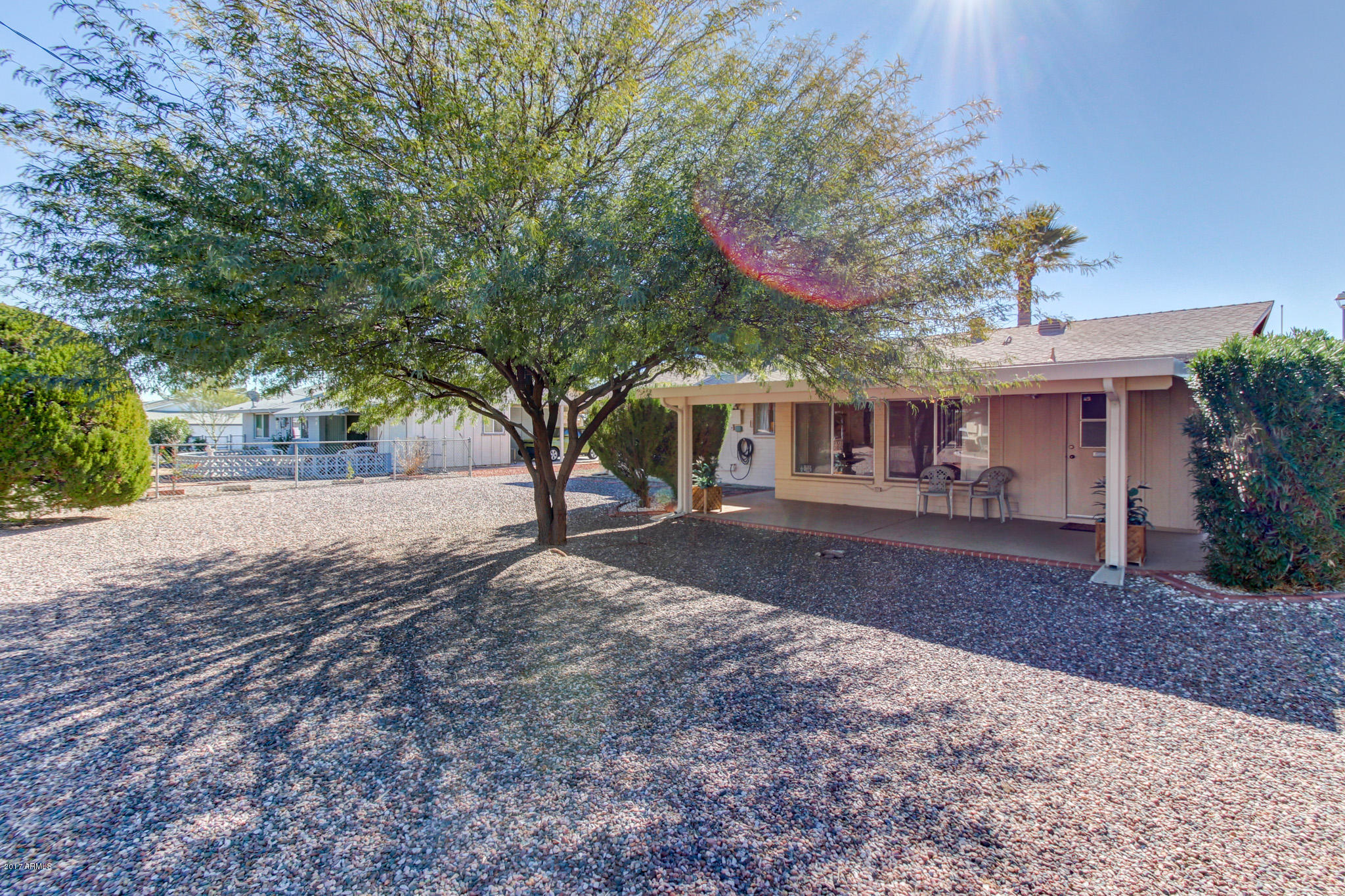 10008 West Riviera Drive Sun City, AZ 85351 - Photo 6 of 26 a front view of a house with a yard