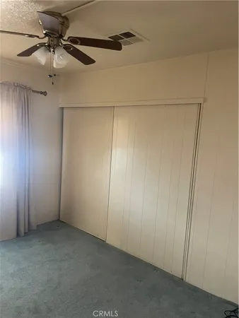 an empty room with fan