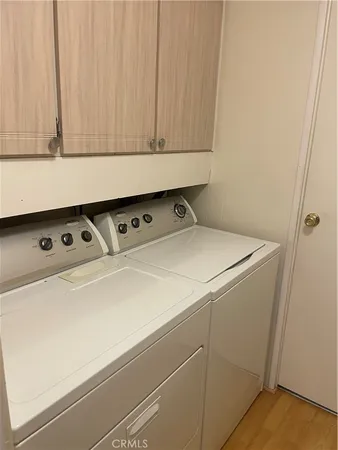 a close view of utility room with washer and dryer