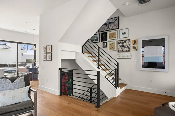 a view of entryway livingroom and hall with wooden floor