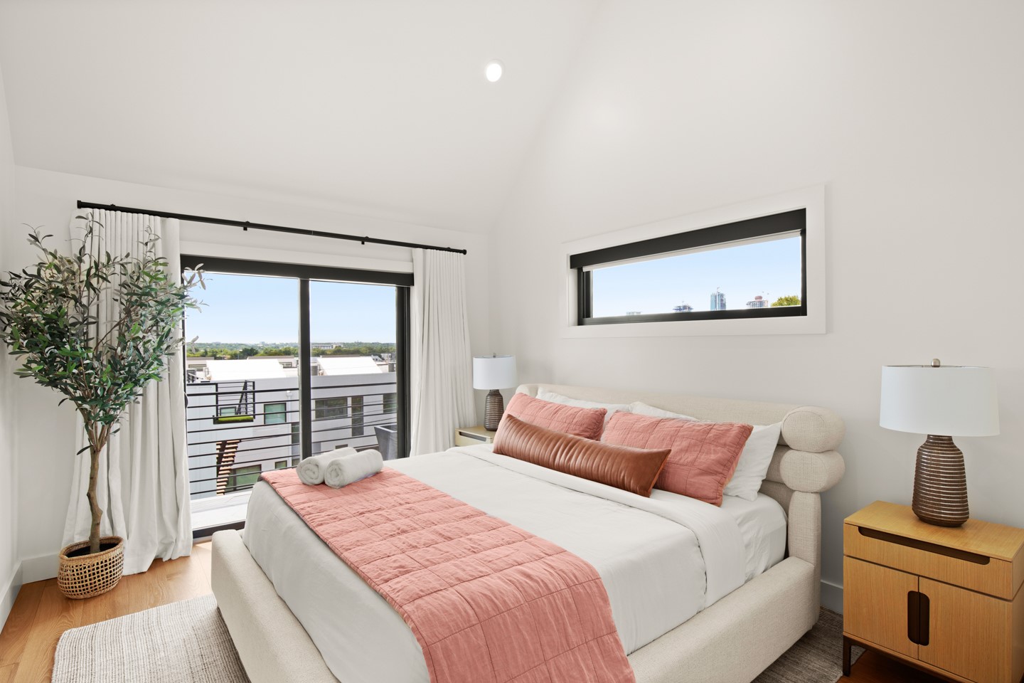 2005 East 8th Street, Unit A Austin, TX 78702 - Photo 12 of 36 a bedroom with a large bed and a large window