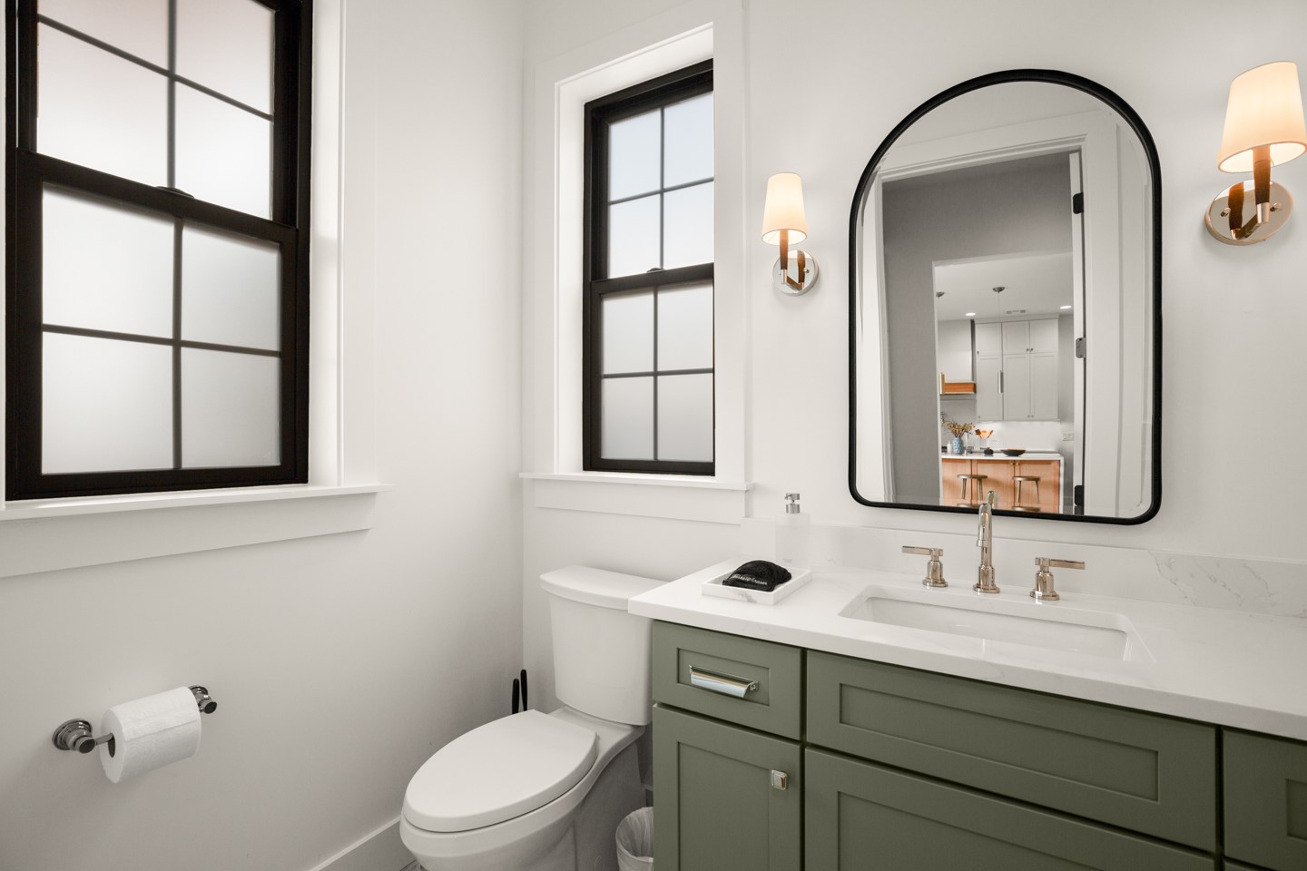 2005 East 8th Street, Unit A Austin, TX 78702 - Photo 20 of 36 a bathroom with a toilet a sink a mirror and a window