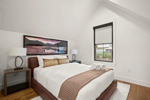 a bedroom with a bed and window