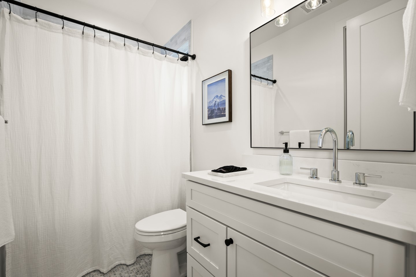 2005 East 8th Street, Unit A Austin, TX 78702 - Photo 22 of 36 a bathroom with a sink a toilet and a mirror