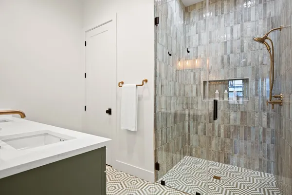 a bathroom with a sink and shower