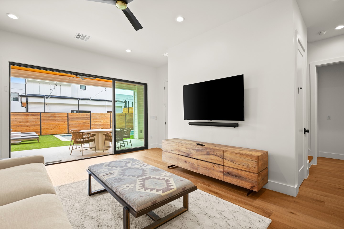 2005 East 8th Street, Unit A Austin, TX 78702 - Photo 29 of 36 a living room with furniture and a flat screen tv