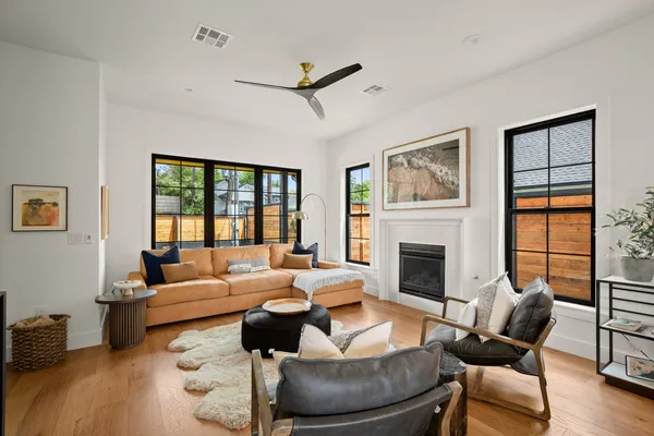 a living room with furniture and a fireplace