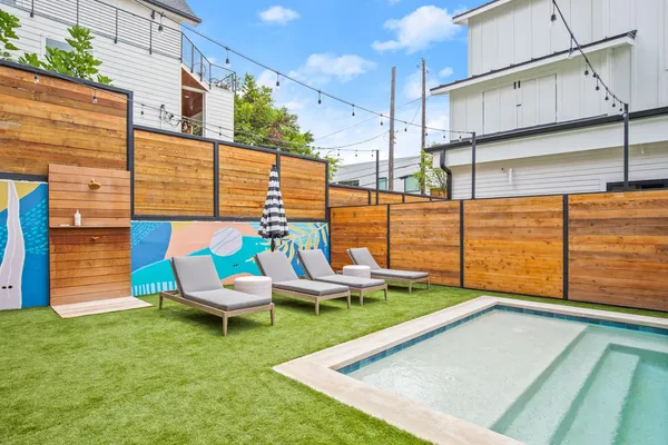 a view of a chair and tables in the patio